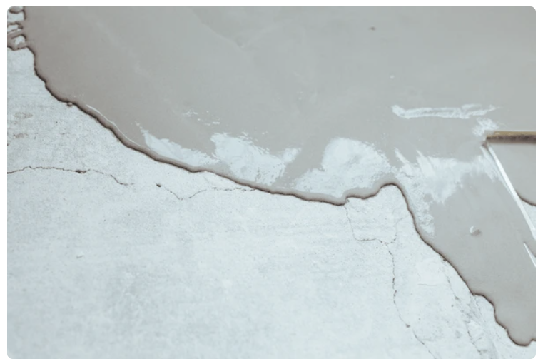 Concrete repair materials and surface preparation